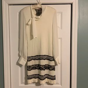 Vintage twelve by twelve mini dress with beading, a neck tie, and sheer sleeves!